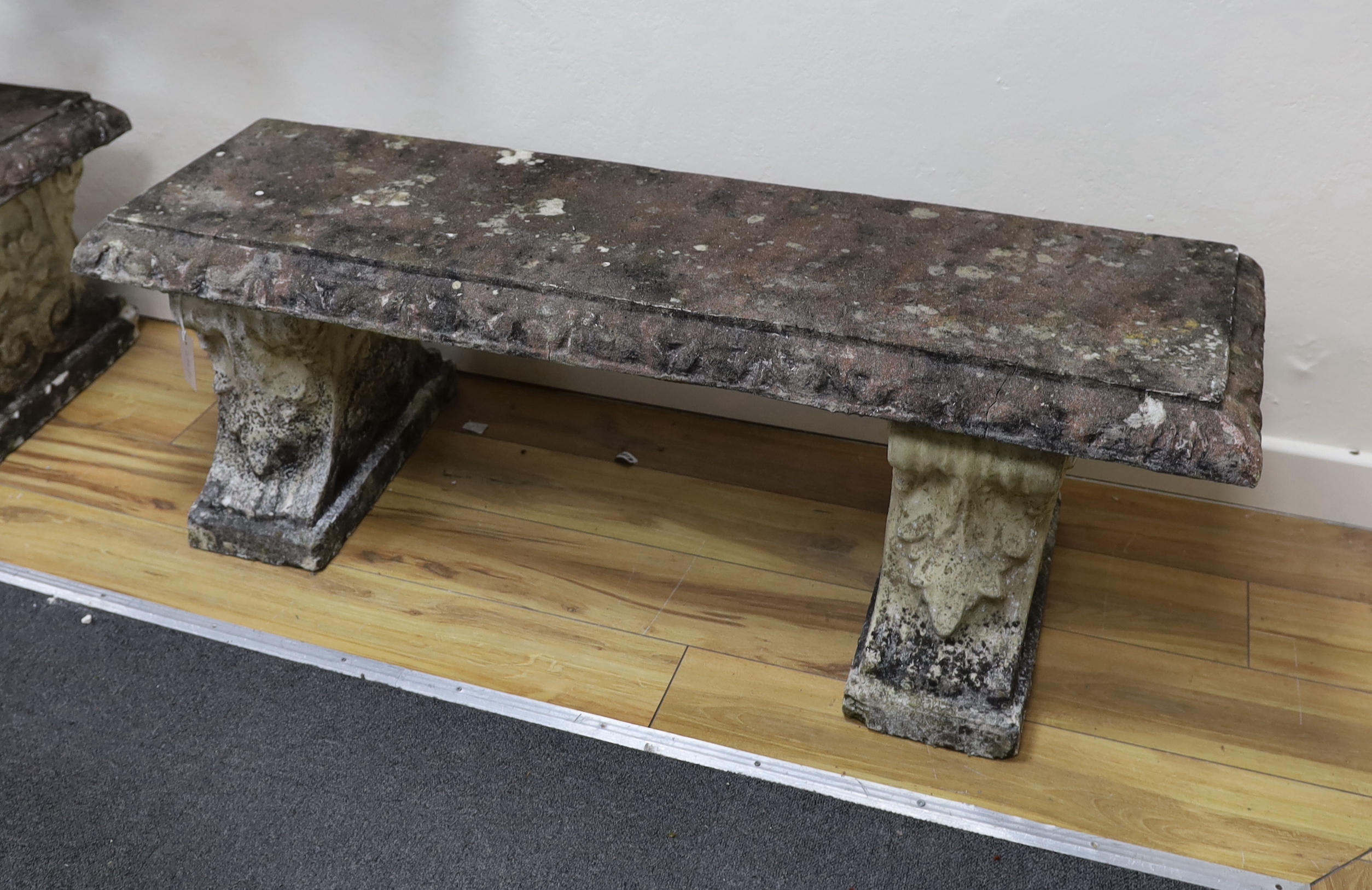 A pair of rectangular reconstituted stone garden bench seats, width 125cm, depth 40cm, height 42cm